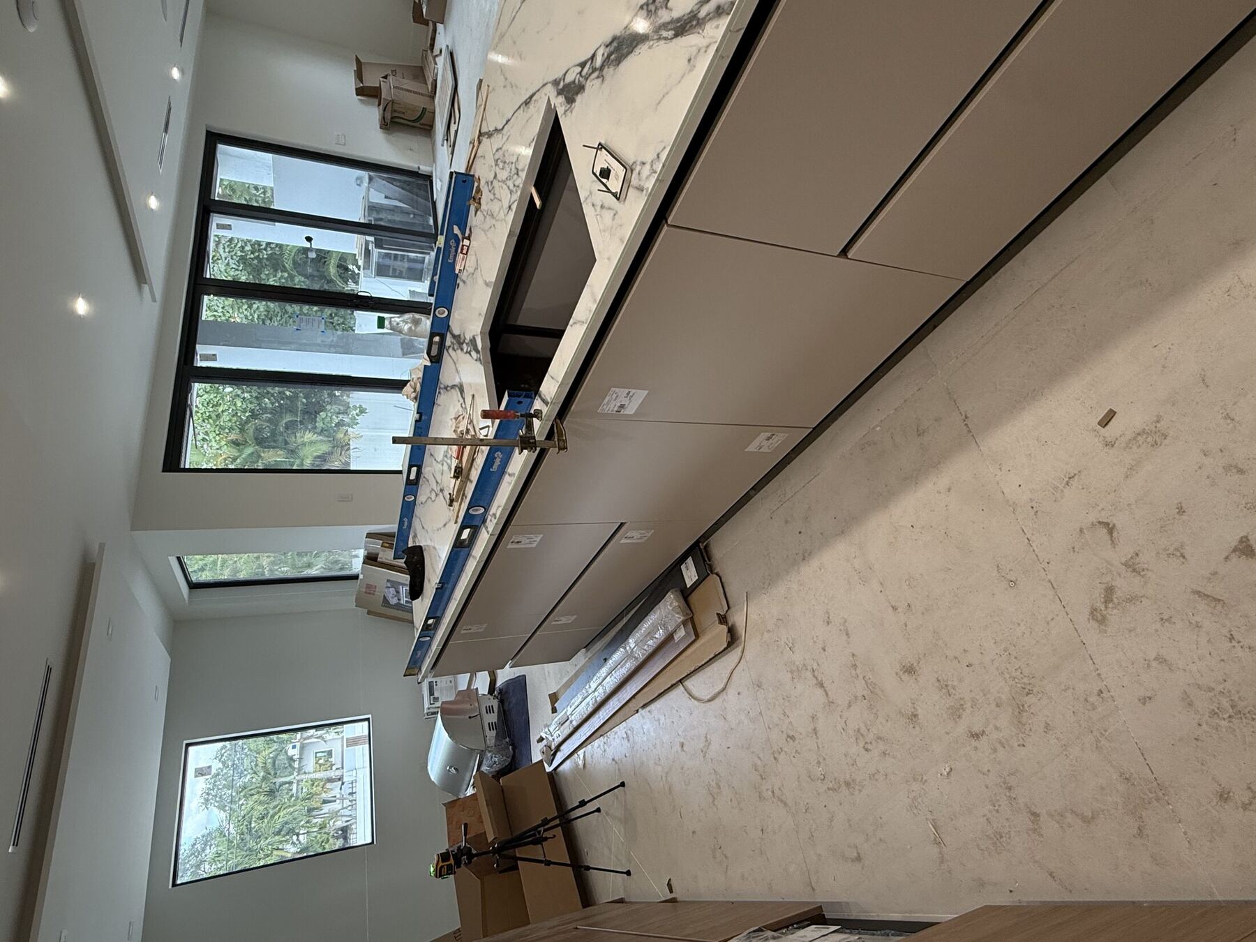 Marble countertop being leveled during installation